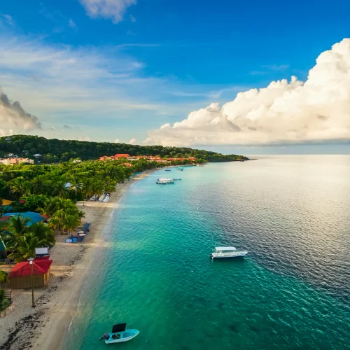 stock-photo-an-aerial-view-of-a-tropical-beach-in-roat-n-honduras-early-in-the-morning-611005574